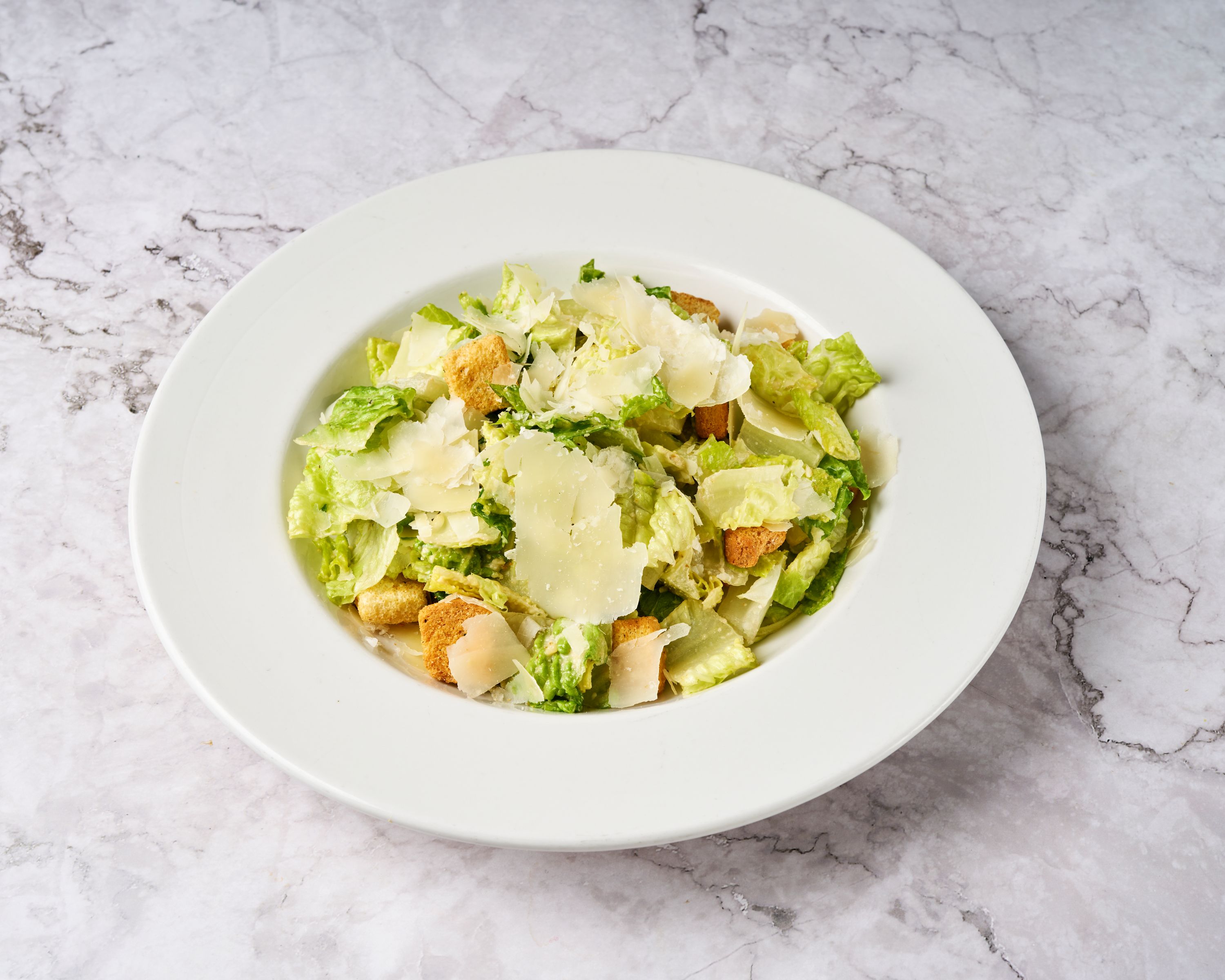 A plated salad of mixed greens